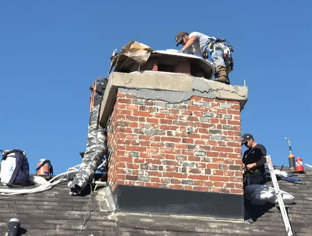 Montville Chimney Sweep installing a custom chimney crown in Montville, CT