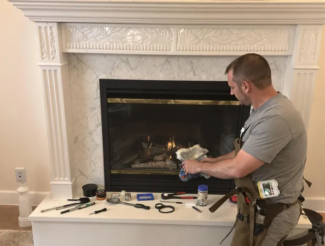 Montville Chimney Sweep performing fireplace maintenance in Montville, CT