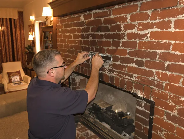 Montville Chimney Sweep expert fixing a fireplace in Montville, CT